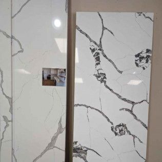 Two white marble-pattern tile panels with gray veining, separated by a narrow vertical gap.