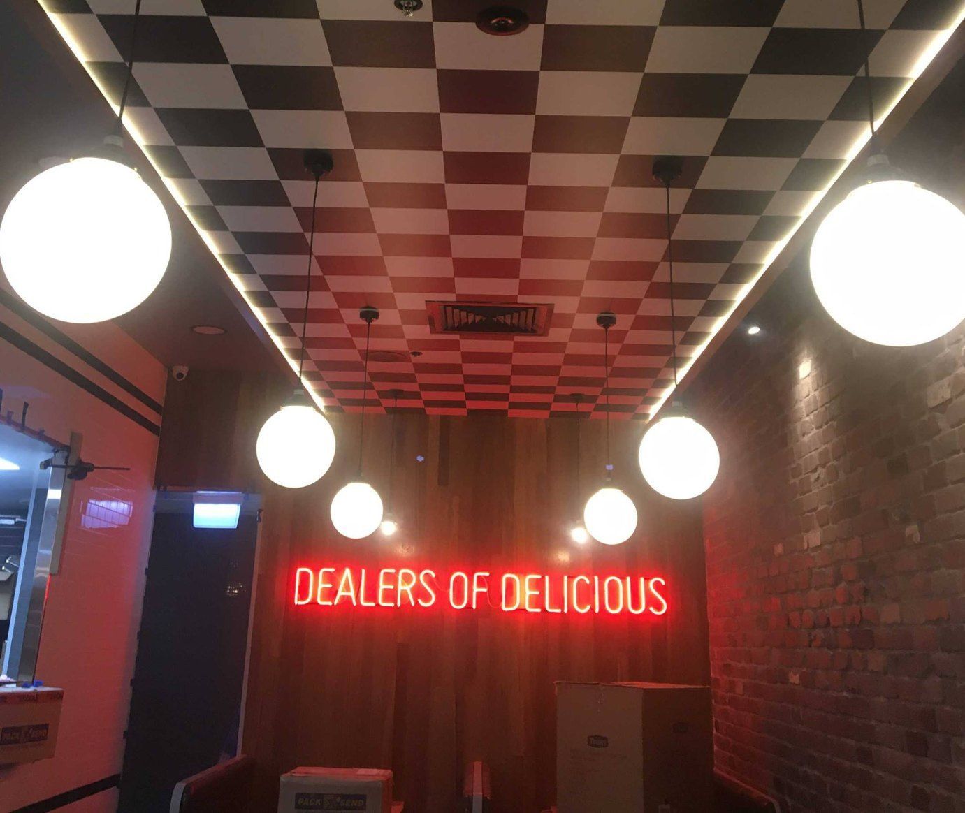 A rEstaurant With a Neon Sign That Says Dealers of Delicious — Signtek Gladstone in Gladstone Central, QLD