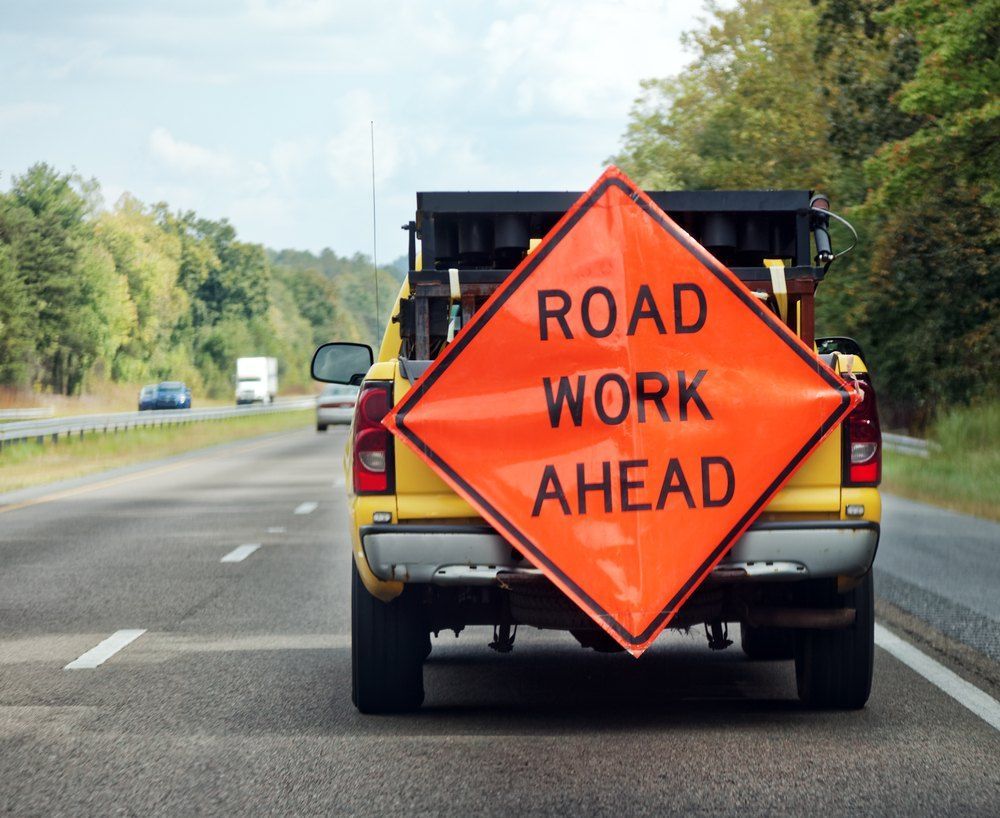 A Road Work Ahead Sign is Attached to the Back of a Truck — Signtek Gladstone in Gladstone Central, QLD