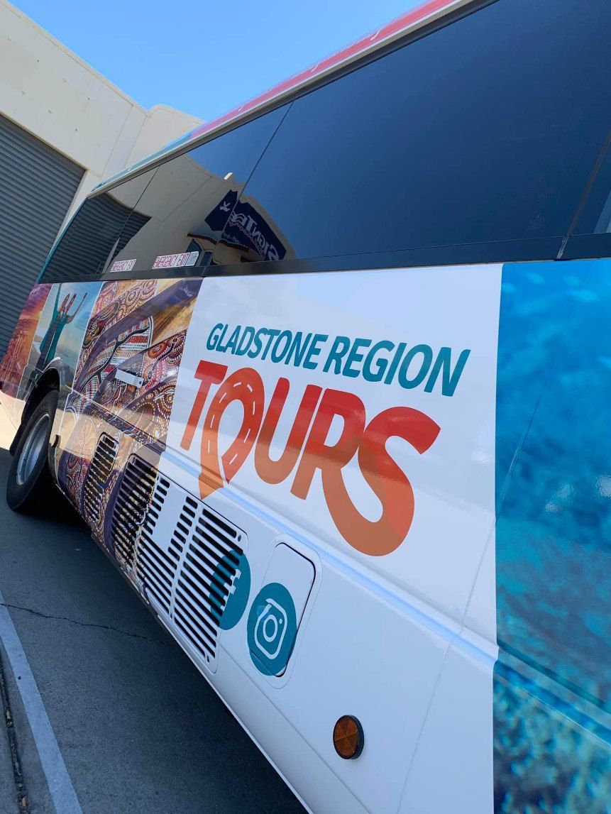A Bus With the Word Tours on the Side of It — Signtek Gladstone in Gladstone Central, QLD