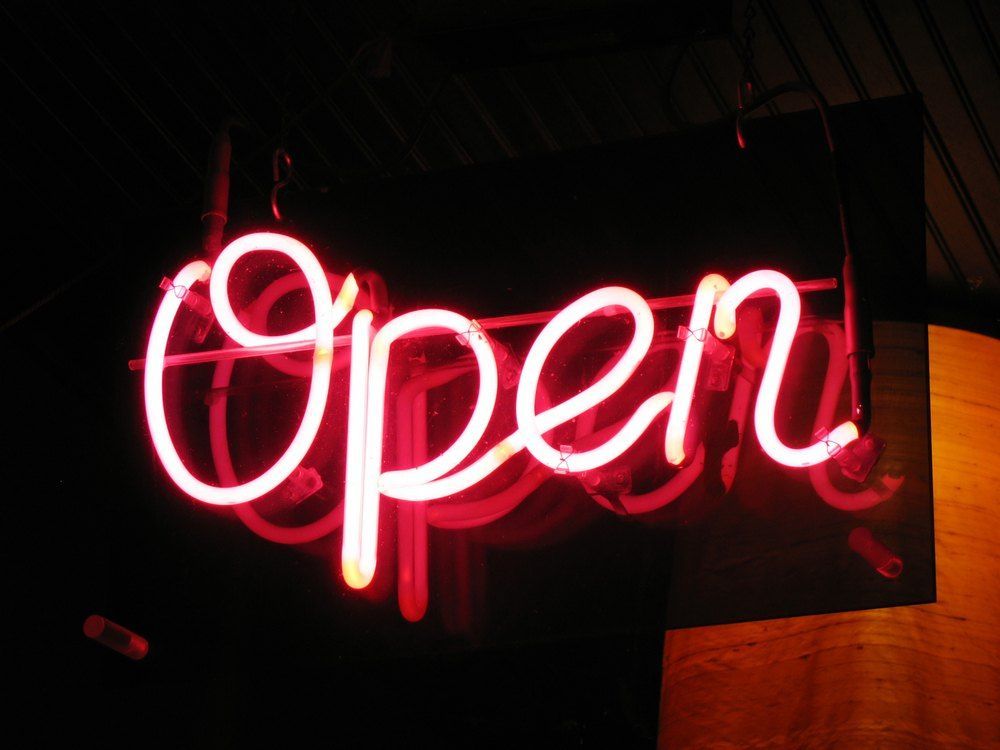 A Neon Sign That Says Open on It — Signtek Gladstone in Bundaberg, QLD