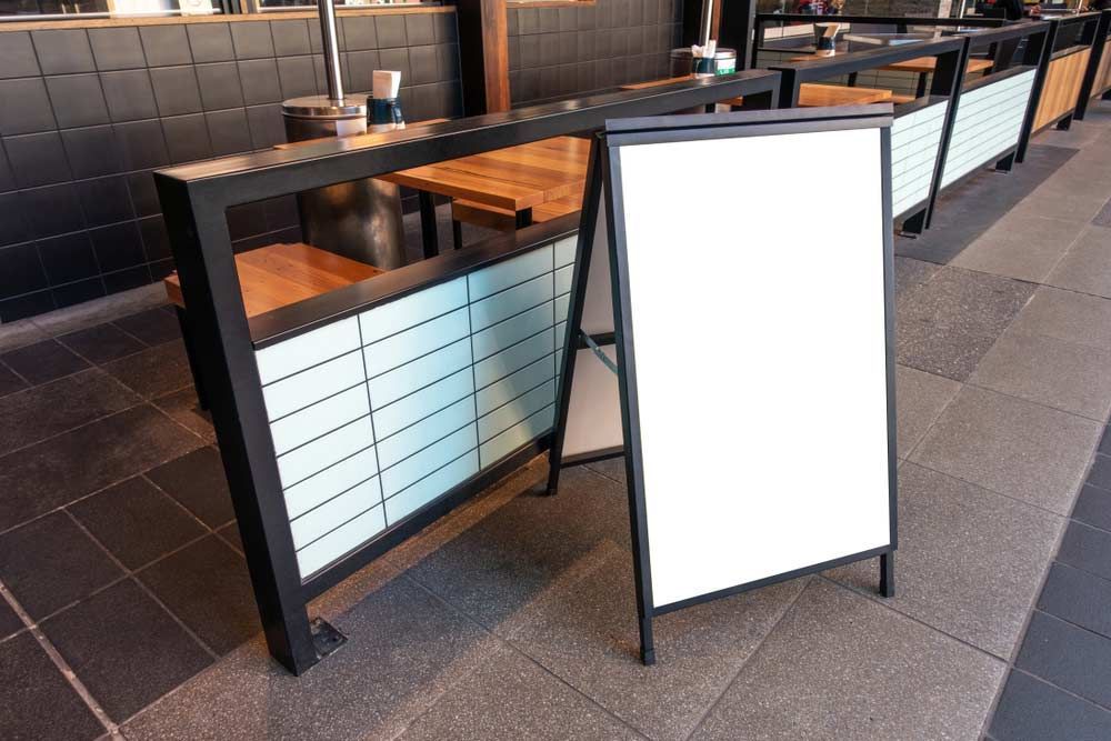 Blank White Outdoor Advertising Stand — Expert Signwriters in Gladstone Central, QLD