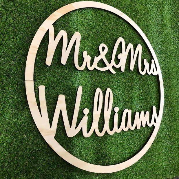 A Wooden Sign That Says Mr. and Mrs. Williams is Sitting on Top of a Lush Green Field — Signtek Gladstone in Rockhampton, QLD