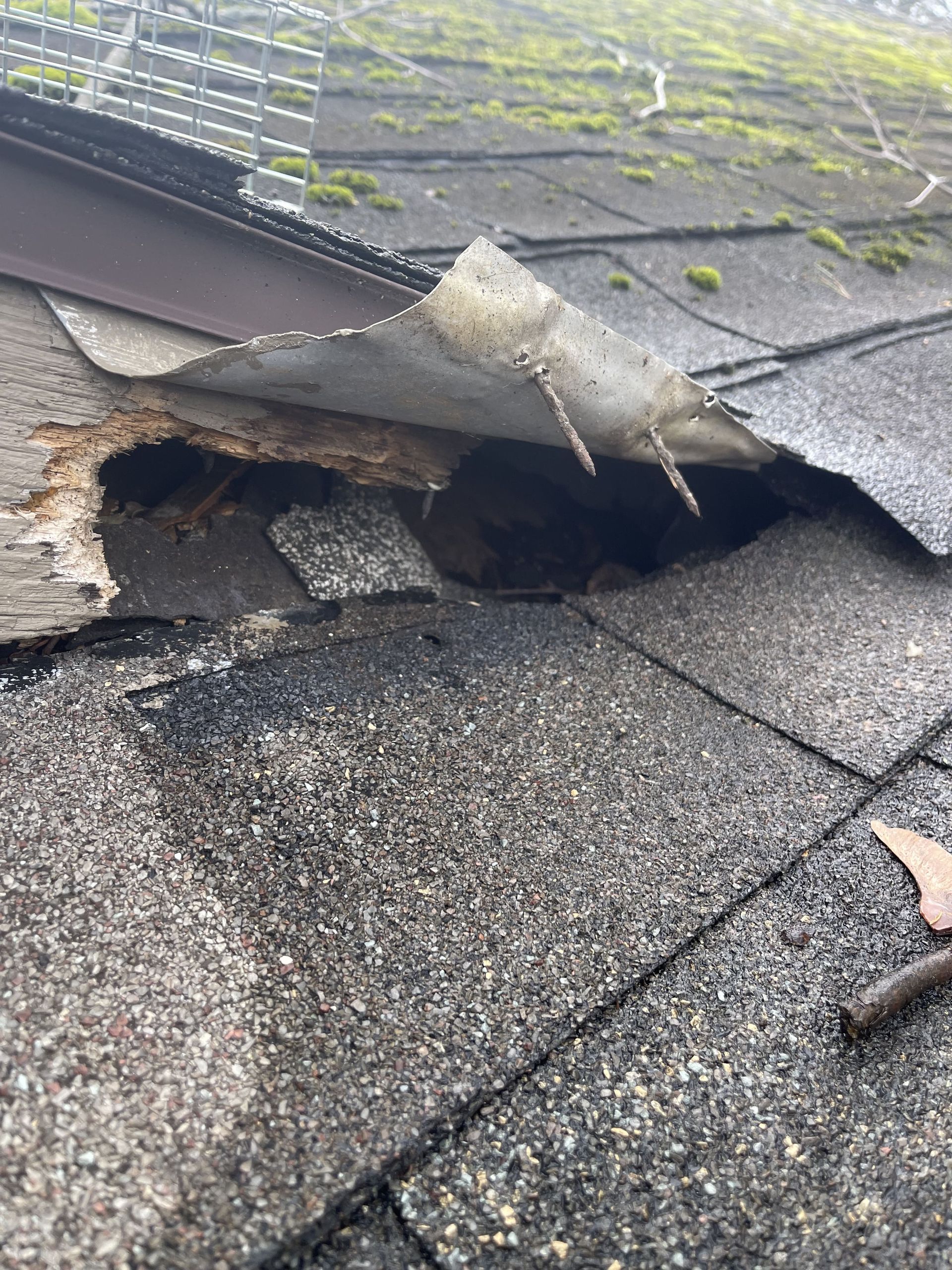 A close up of a roof with a hole in it.