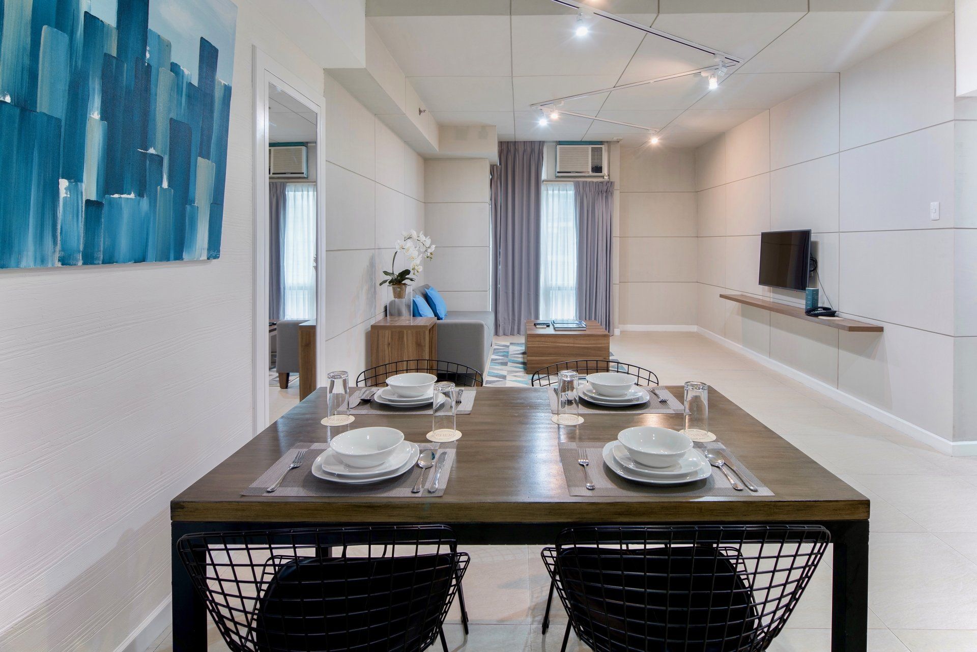 Modern dining area with set table at The Sphere Serviced Residences Makati