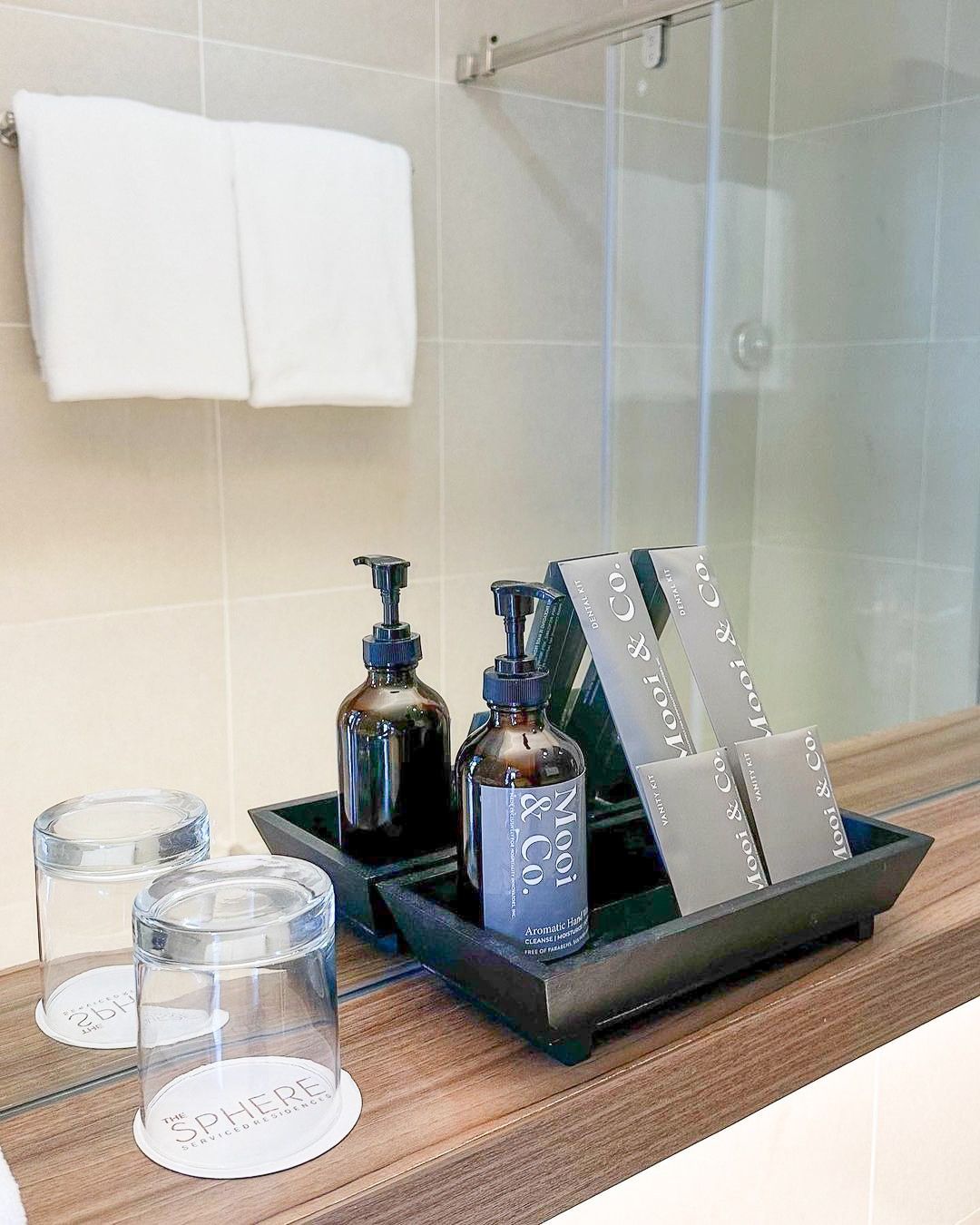 Mooi & Co. toiletries and vanity kits on bathroom counter at The Sphere