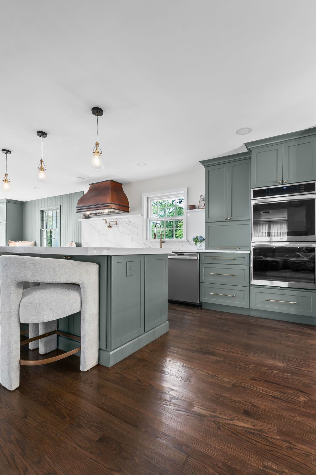 Bright, open‑concept Andover, MA kitchen remodel with white shaker cabinets, large island