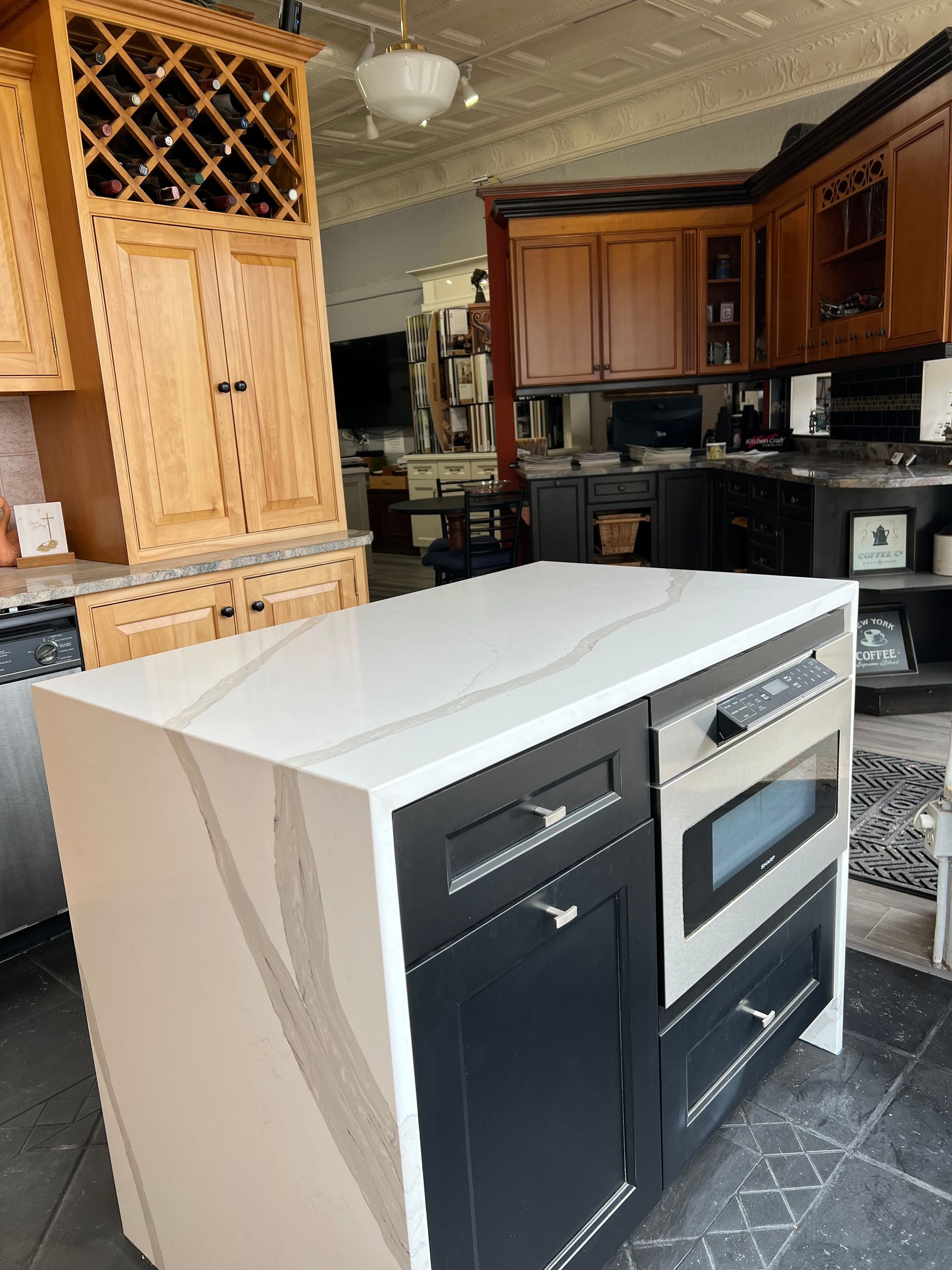 A kitchen with a large island in the middle of it.