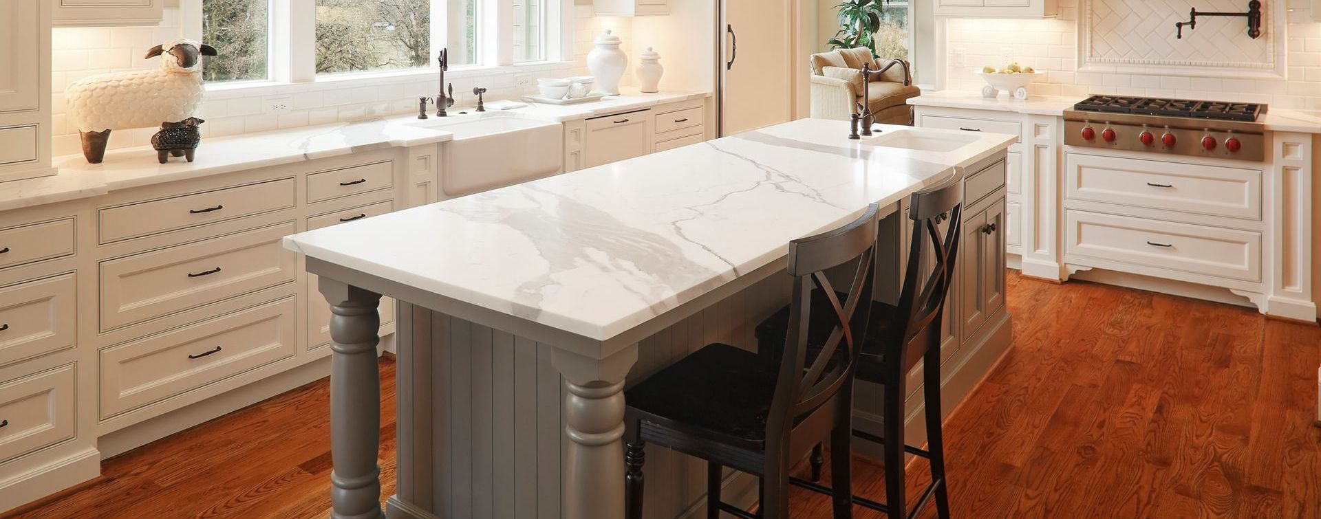 There is a large island in the middle of the kitchen.