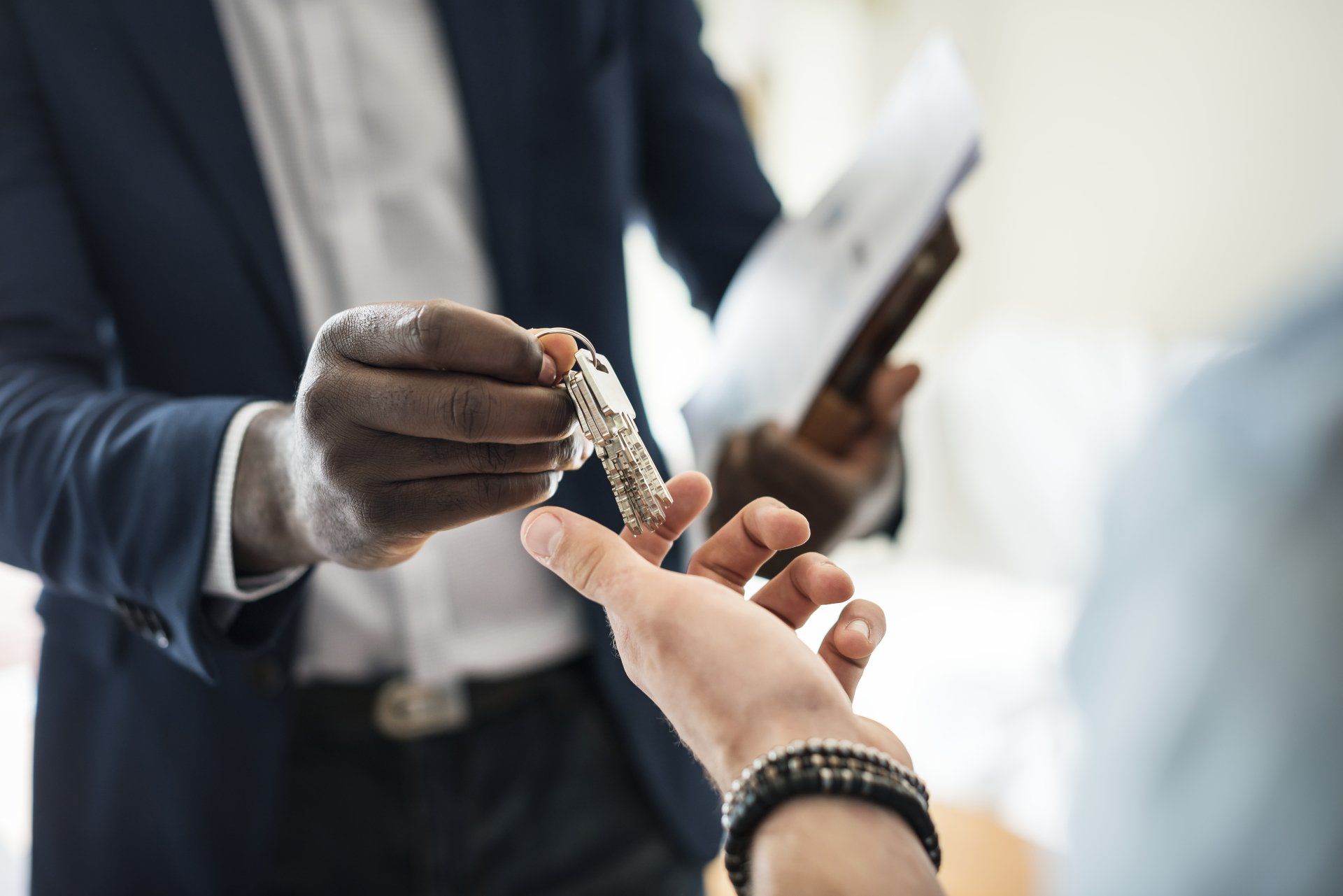 realtor handing homeowner keys