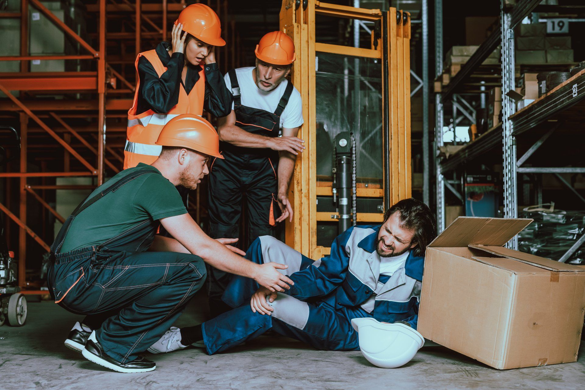 worker injured with coworkers trying to help
