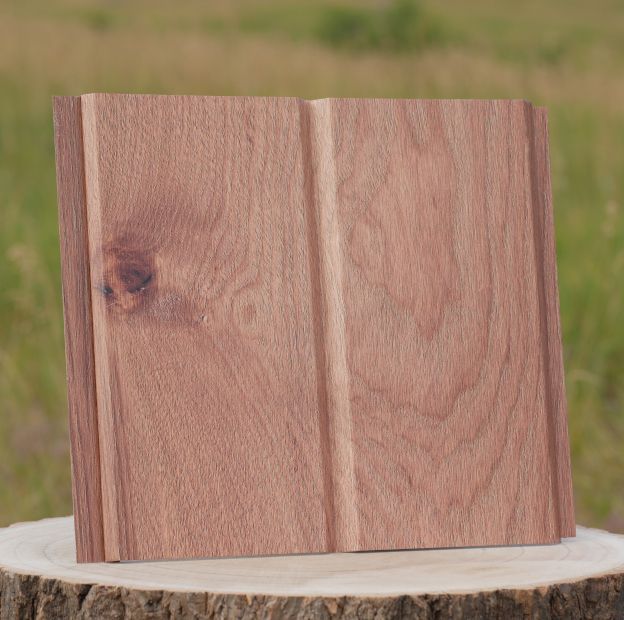 Two-piece wooden block with a natural finish on a tree stump outdoors
