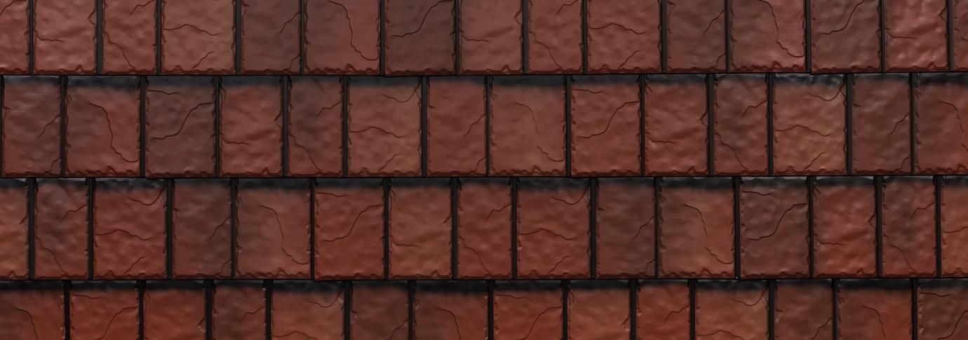 Red brick wall with a repeating staggered pattern.