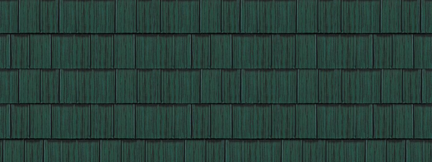 Dark green shingled roof with a small rectangular skylight centered near the top.