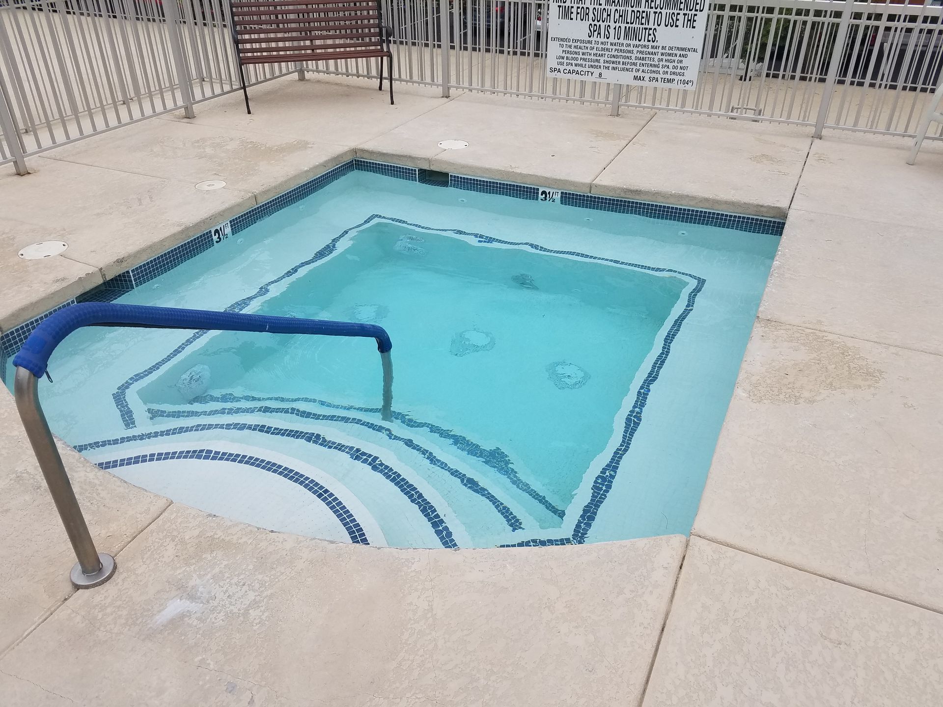 A large swimming pool with stairs leading up to it