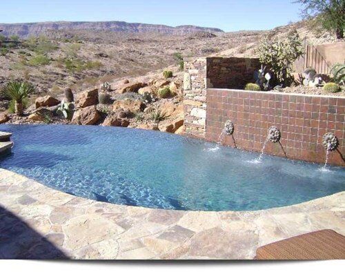 A large swimming pool with a mountain in the background