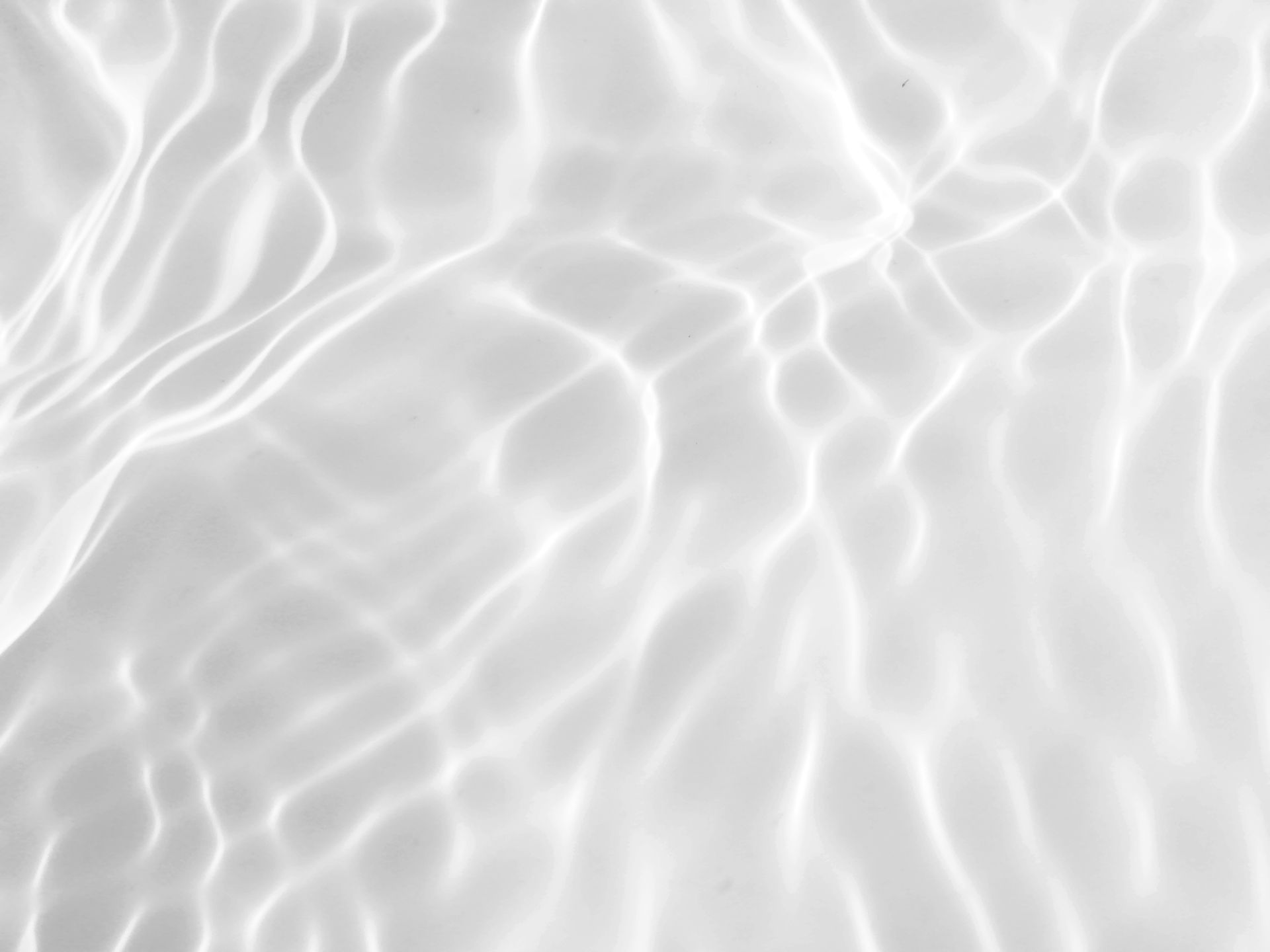 A close up of a white water surface with waves.