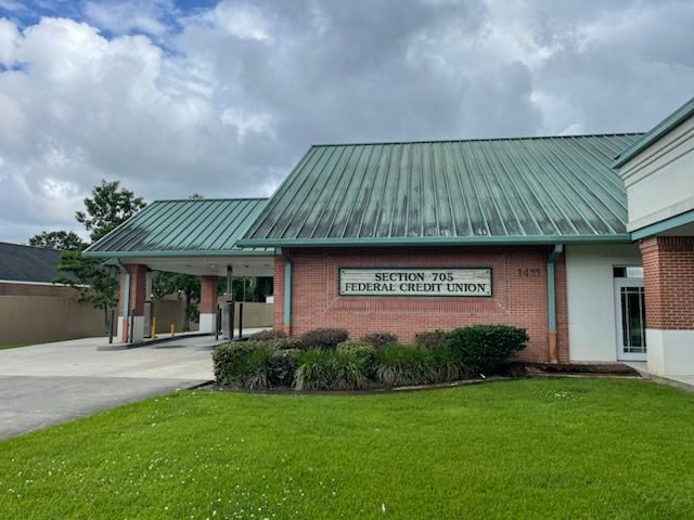 Section 706, Statesville Credit Union building with brick facade and green metal roof.