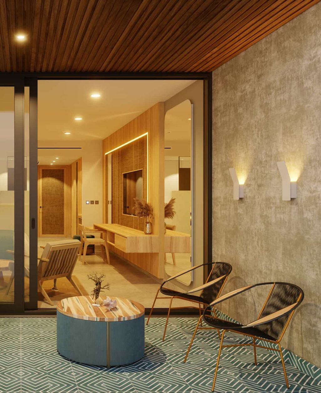 Balcony with chairs, table, and view into a modern living room. Concrete wall with sconces.
