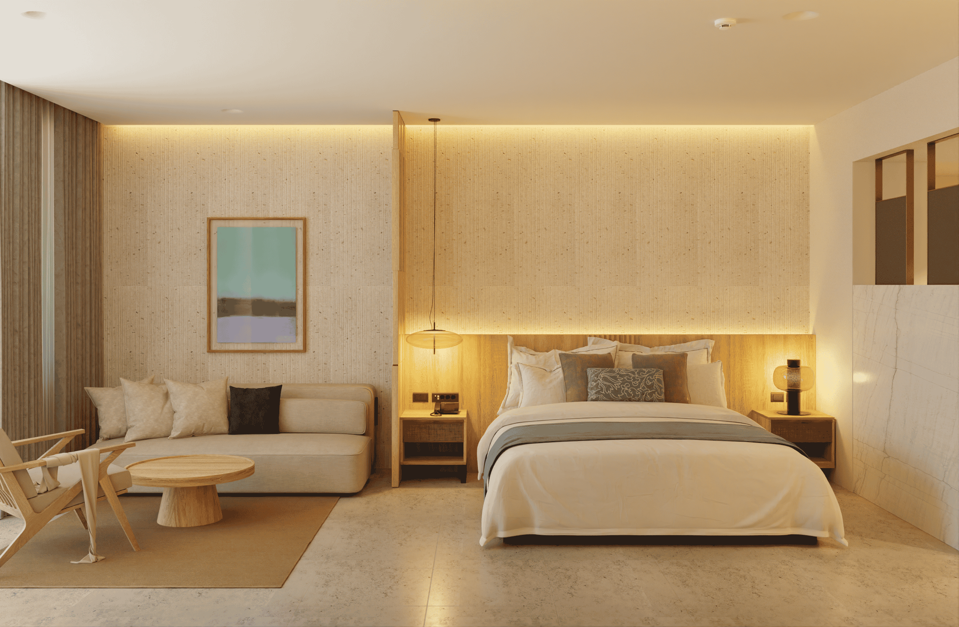 Modern hotel room with neutral tones, bed, seating area, and artwork.