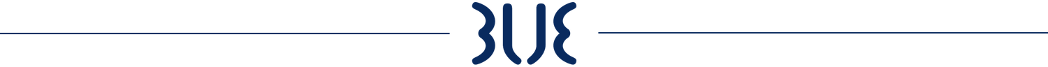 Family in a pool: father and children smiling, floating on a ring, blue water.