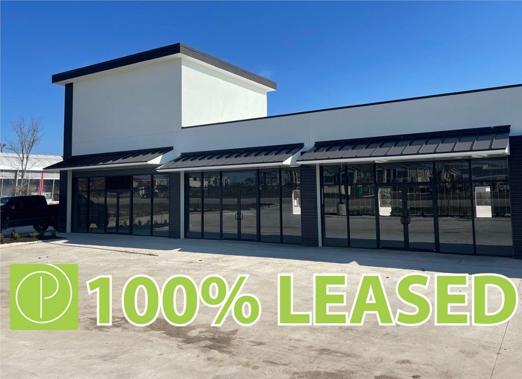 a picture of a building that is 100 % leased