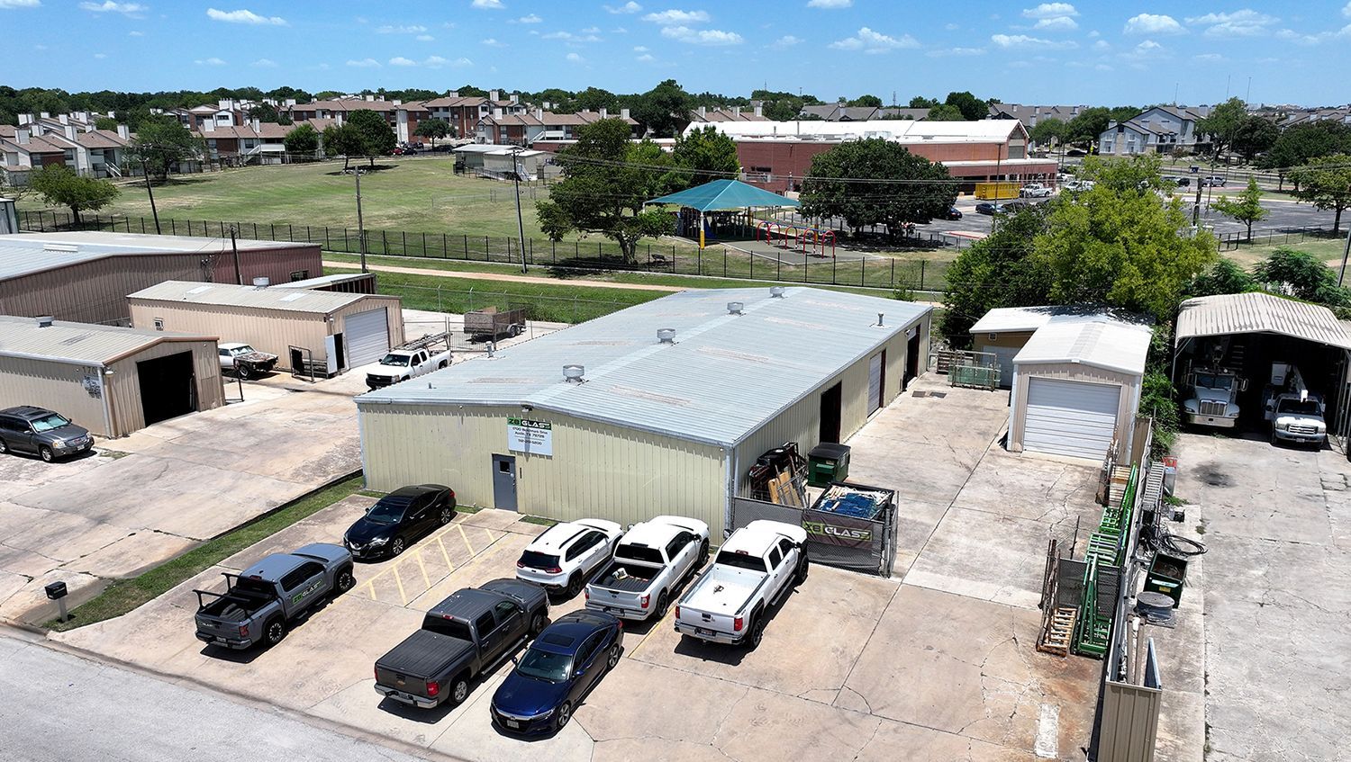 An aerial view of a business and parking lot