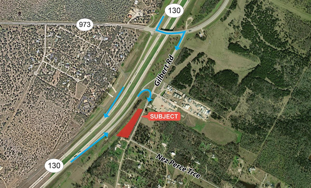 Satellite view of a highway interchange with blue route lines and a red highlighted section near a wooded area
