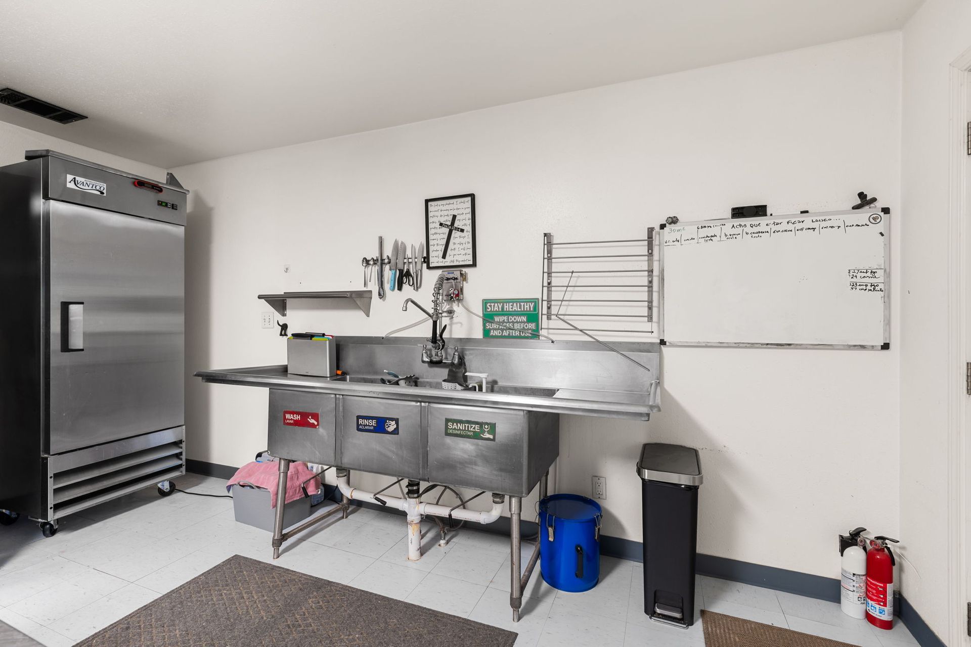 608 n Church St Studio-style guest suite with queen bed, kitchenette, workspace, closet storage, and private bath access.