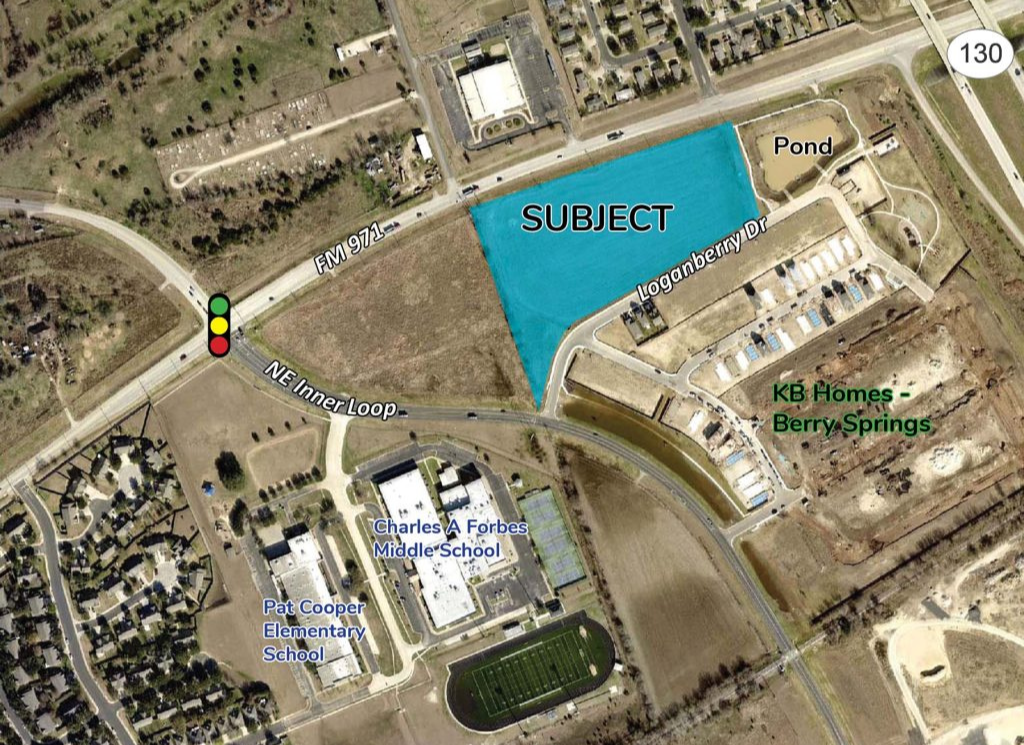 an aerial view of a residential area with a blue area in the middle that says subject