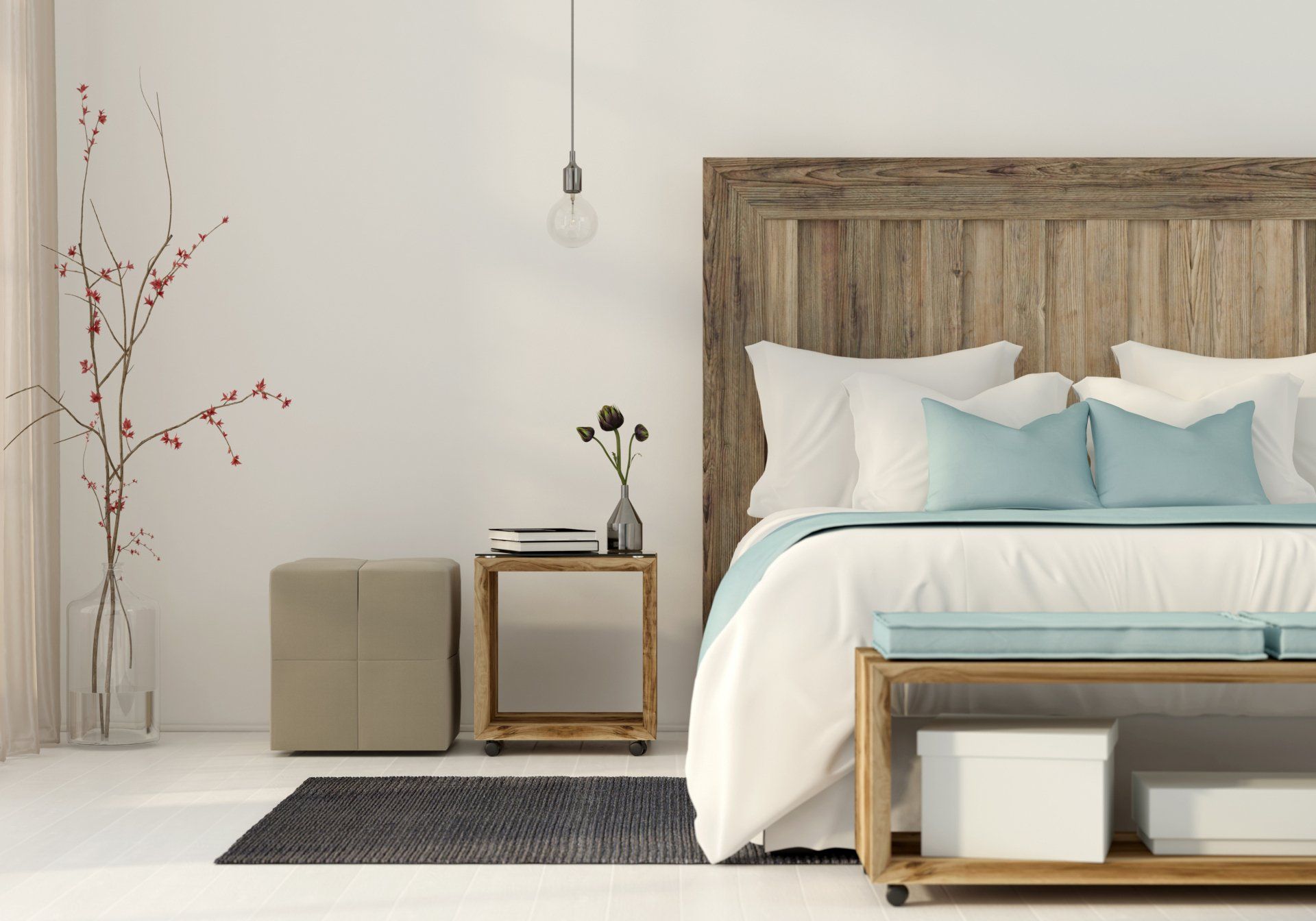 A bedroom with a bed , two nightstands , a bench , and a wooden headboard.
