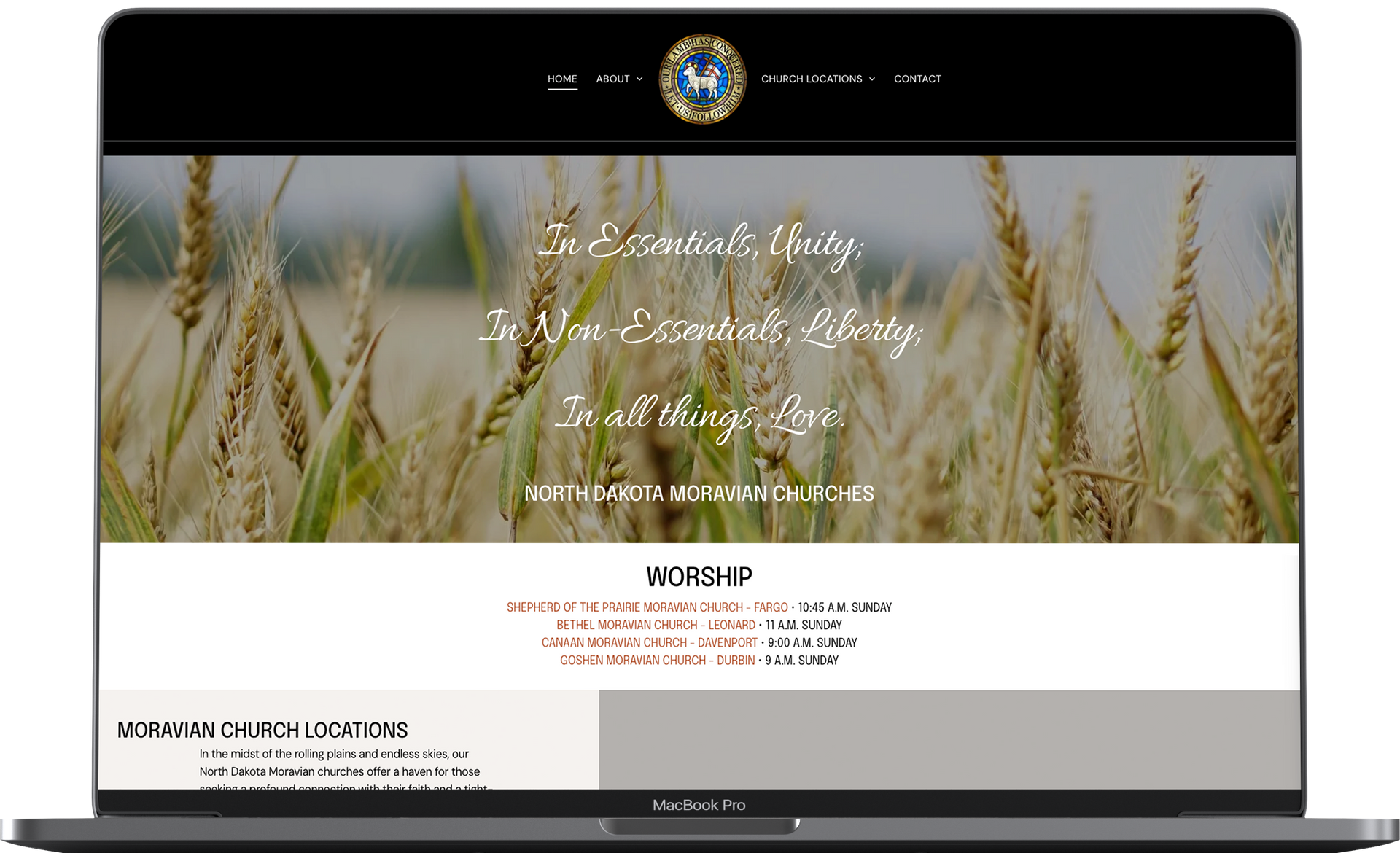 A laptop computer is open to a website with a picture of wheat on the screen.