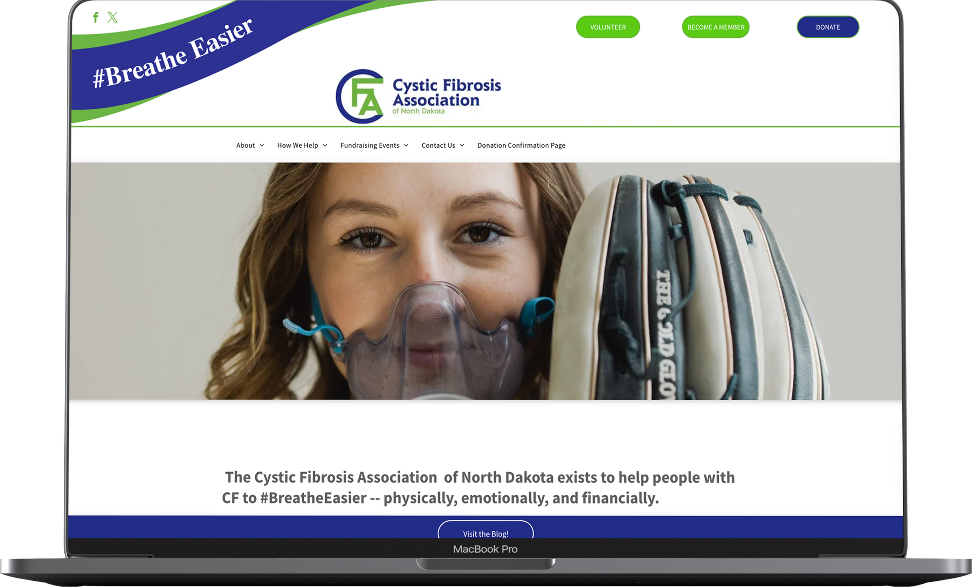 A laptop screen shows a woman wearing an oxygen mask and a helmet.