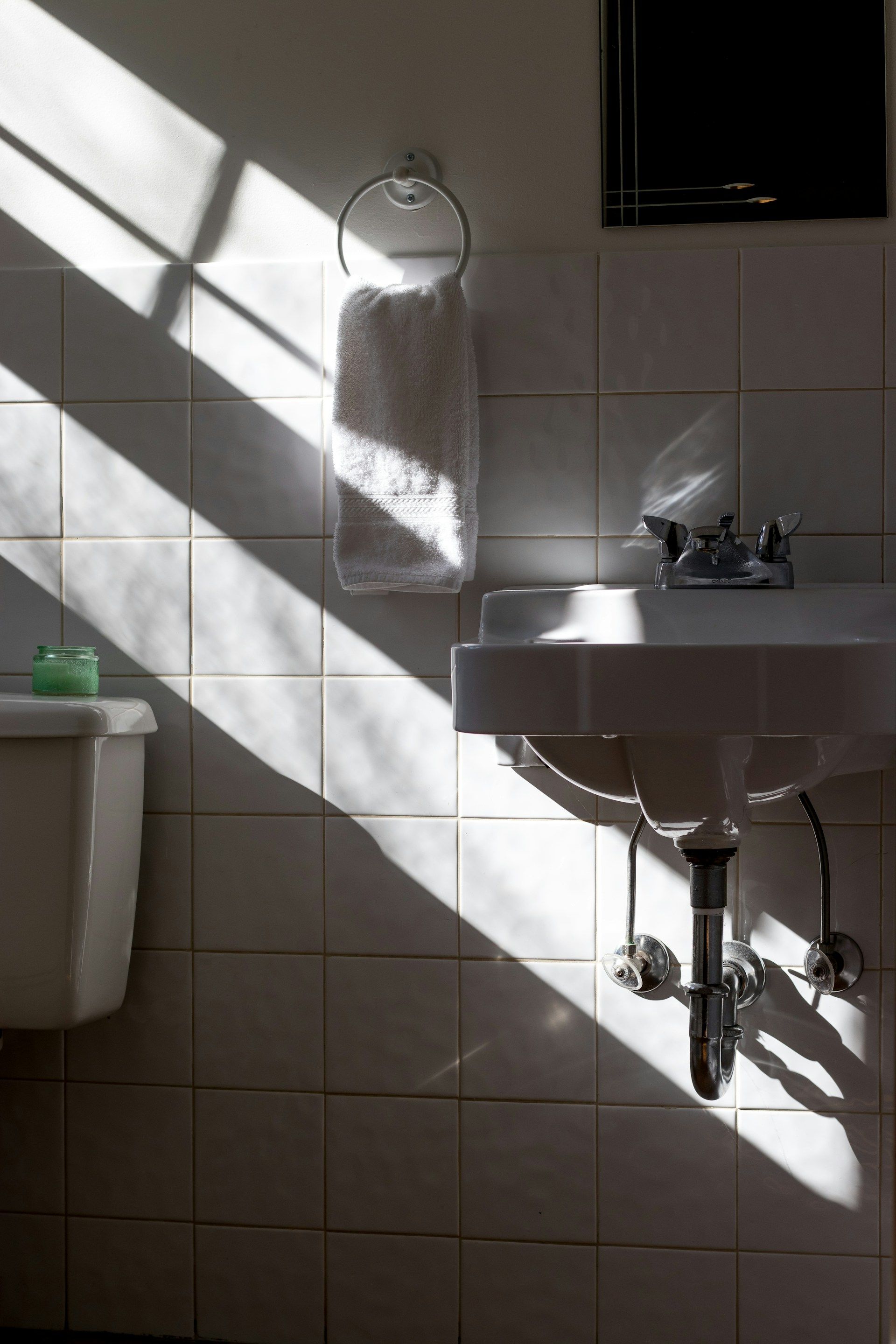 Close-up of a Wet, Dark Sink With a Silver Drain Strainer — Sunset Plumbing NT in Moil, NT