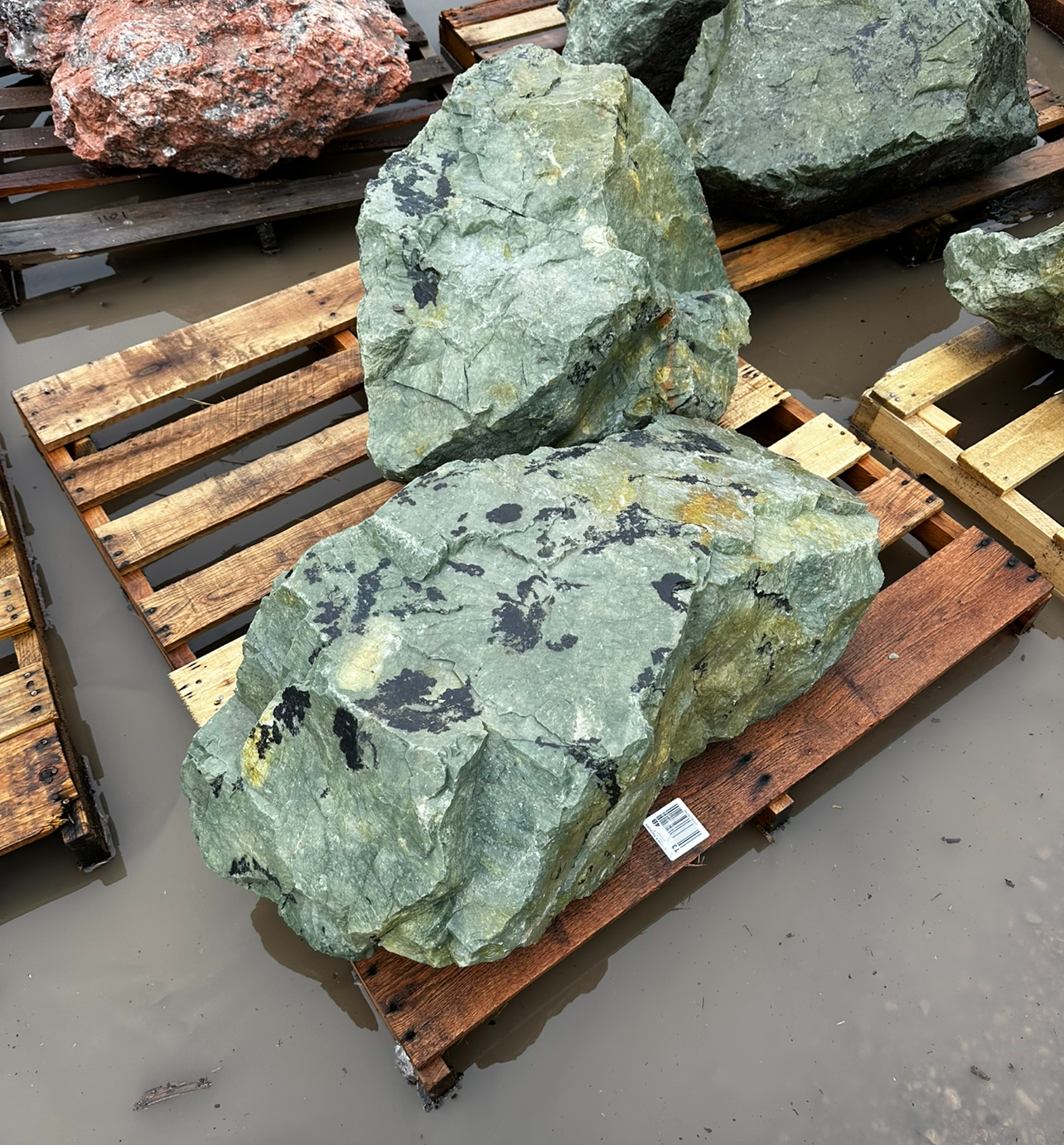 A pile of colorful rocks on a beach.