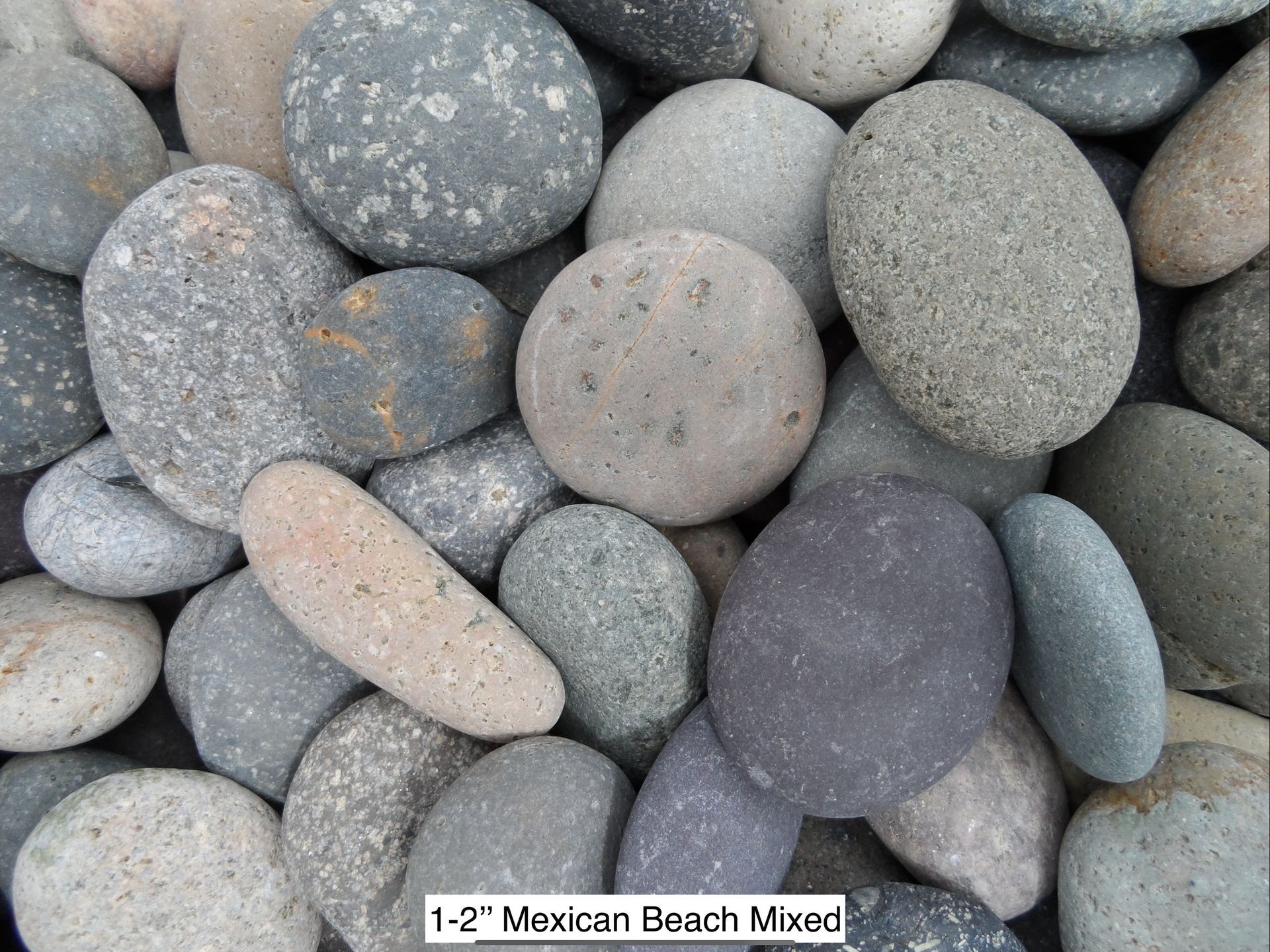 A collection of smooth, multi-colored round river stones labeled