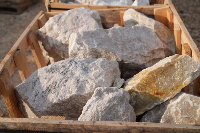 Large landscape rocks in a nursery setting.