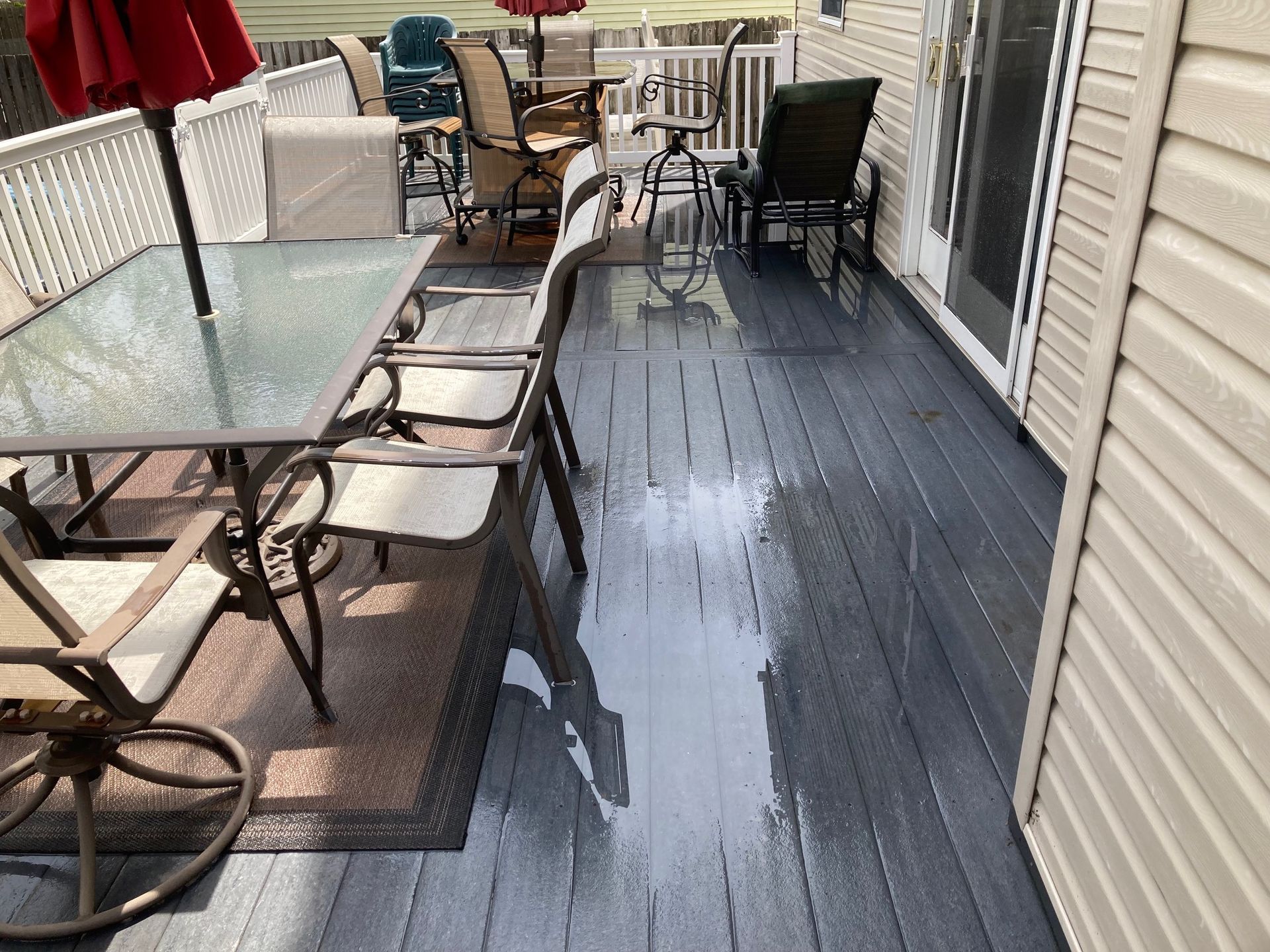 A deck with a table and chairs on it