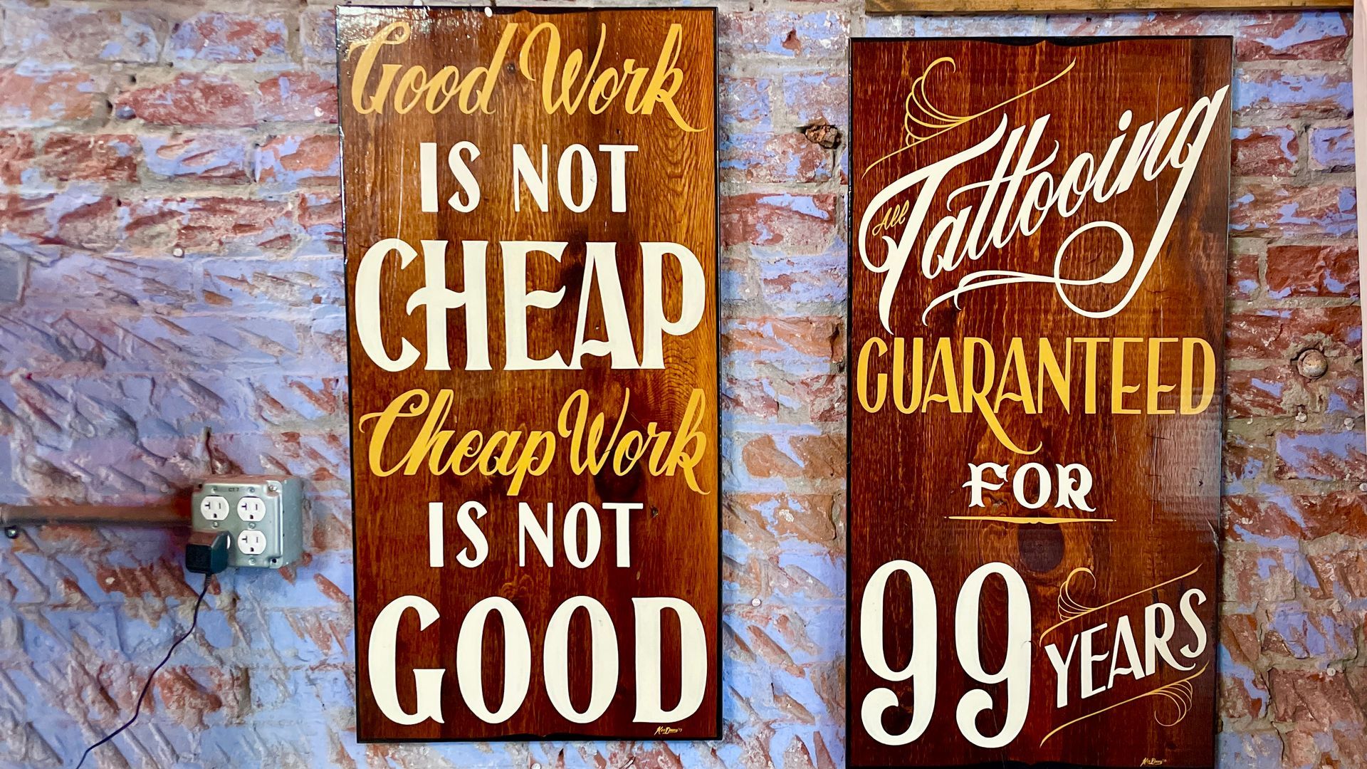 blacksuit tattoo sign