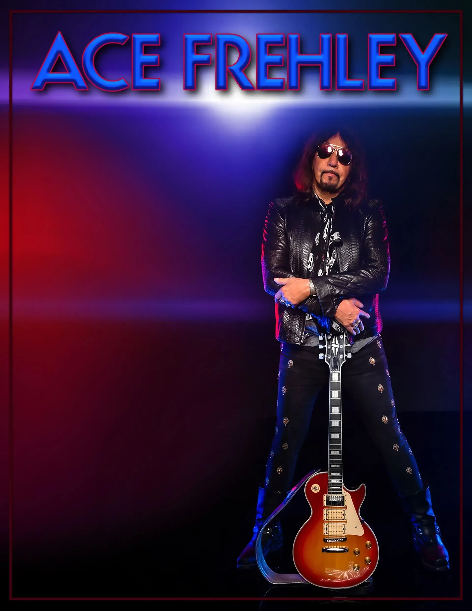Ace Frehley, holding guitar, in sparkly jacket and pants. Lit stage background: red, blue, and purple.