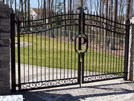 A wrought iron gate with the letter p on it