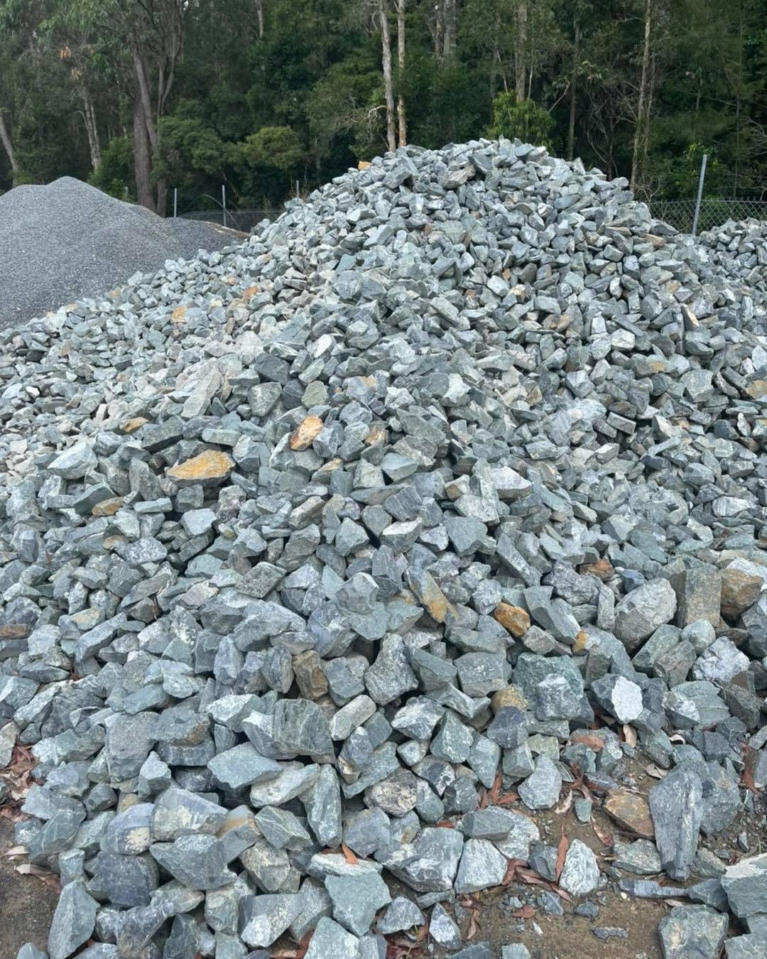 Pile of grey gravel. Trees in the background - Palms Landscape Supplies in Forster, NSW