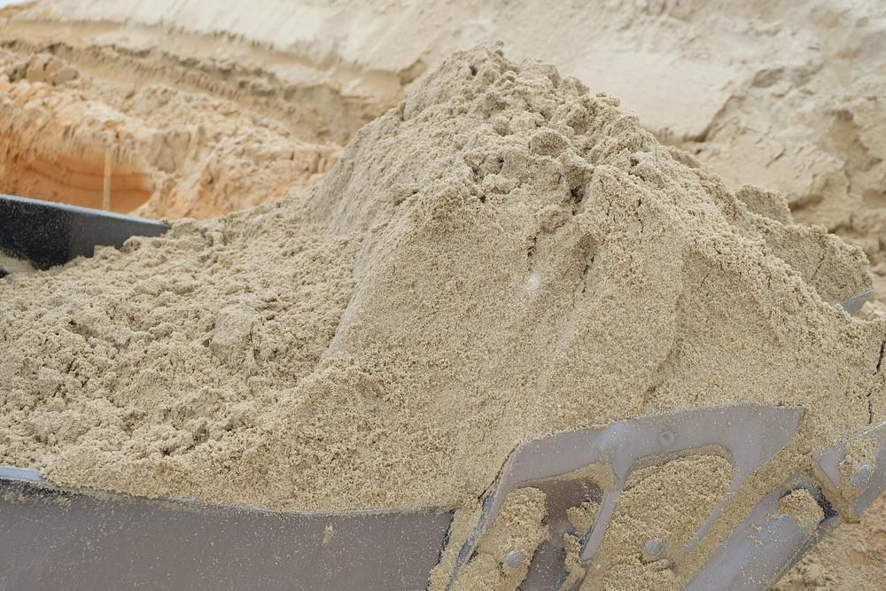 Pile of tan sand in a metal container - Palms Landscape Supplies in Forster, NSW