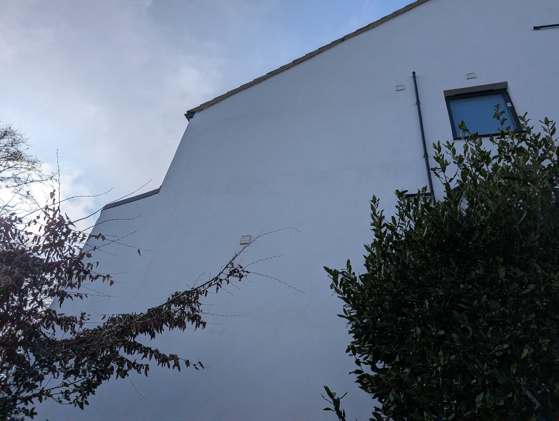 Clean render wall after softwash biocide treatment