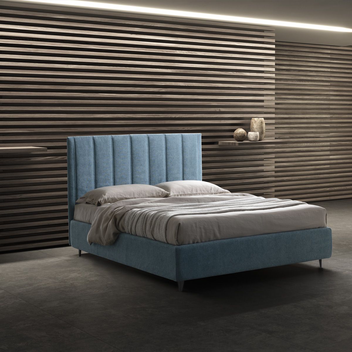 Una camera da letto con un letto blu e una parete di legno