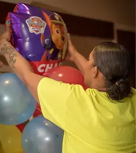 Girl Holding Balloons — Granger, IN — Make 'Em Pop Creations