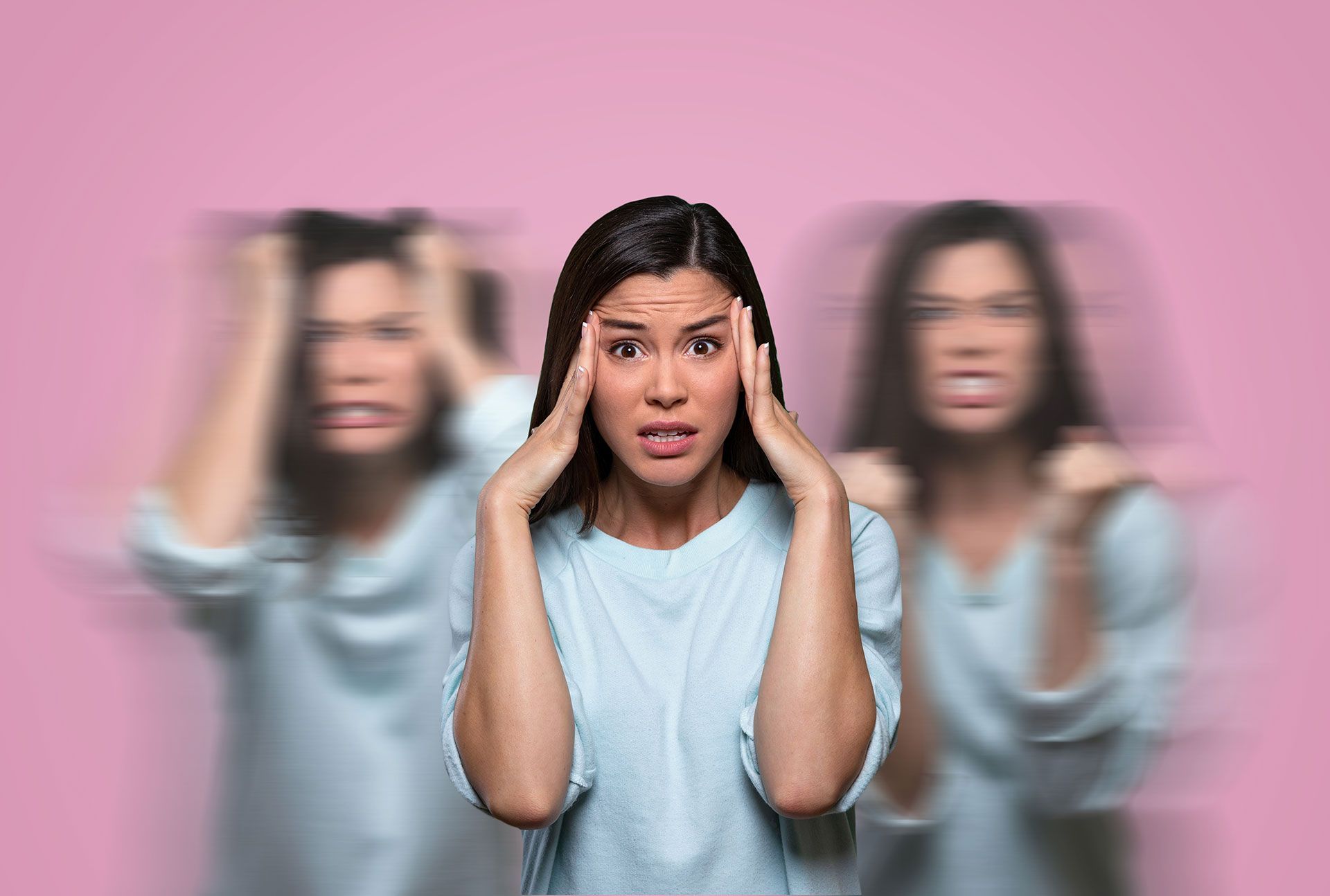 Woman in Blue Shirt Clutching Head, Experiencing Changing Moods