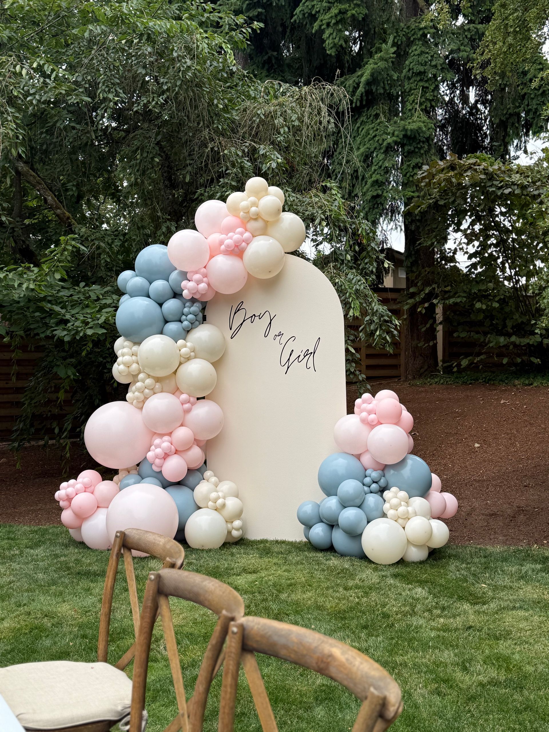 7ft off whit panel with custom wording and a balloon garland