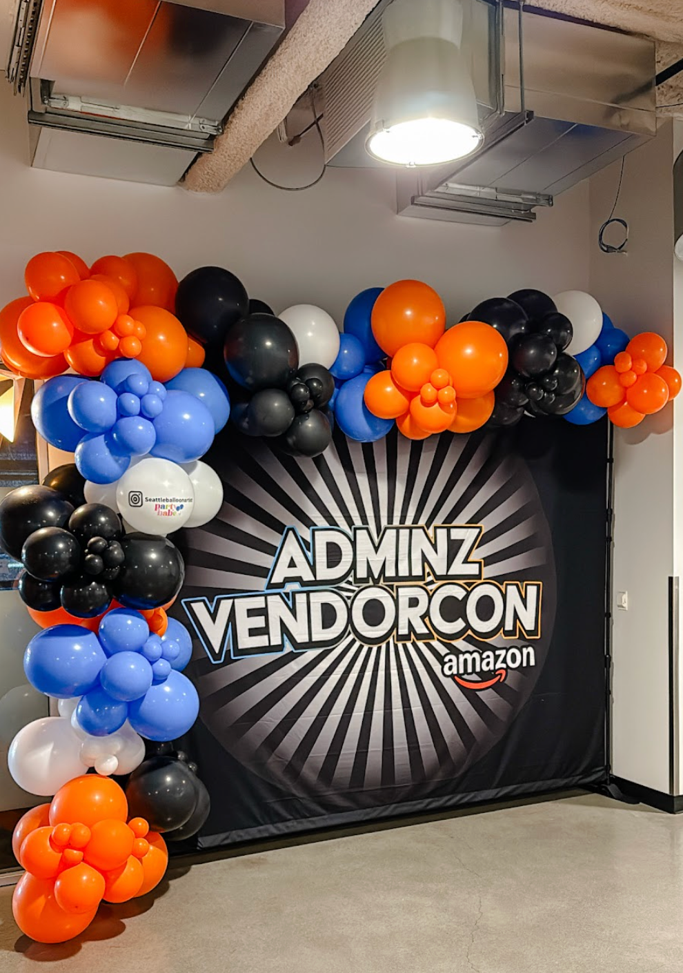 A room filled with balloons and a pool table.