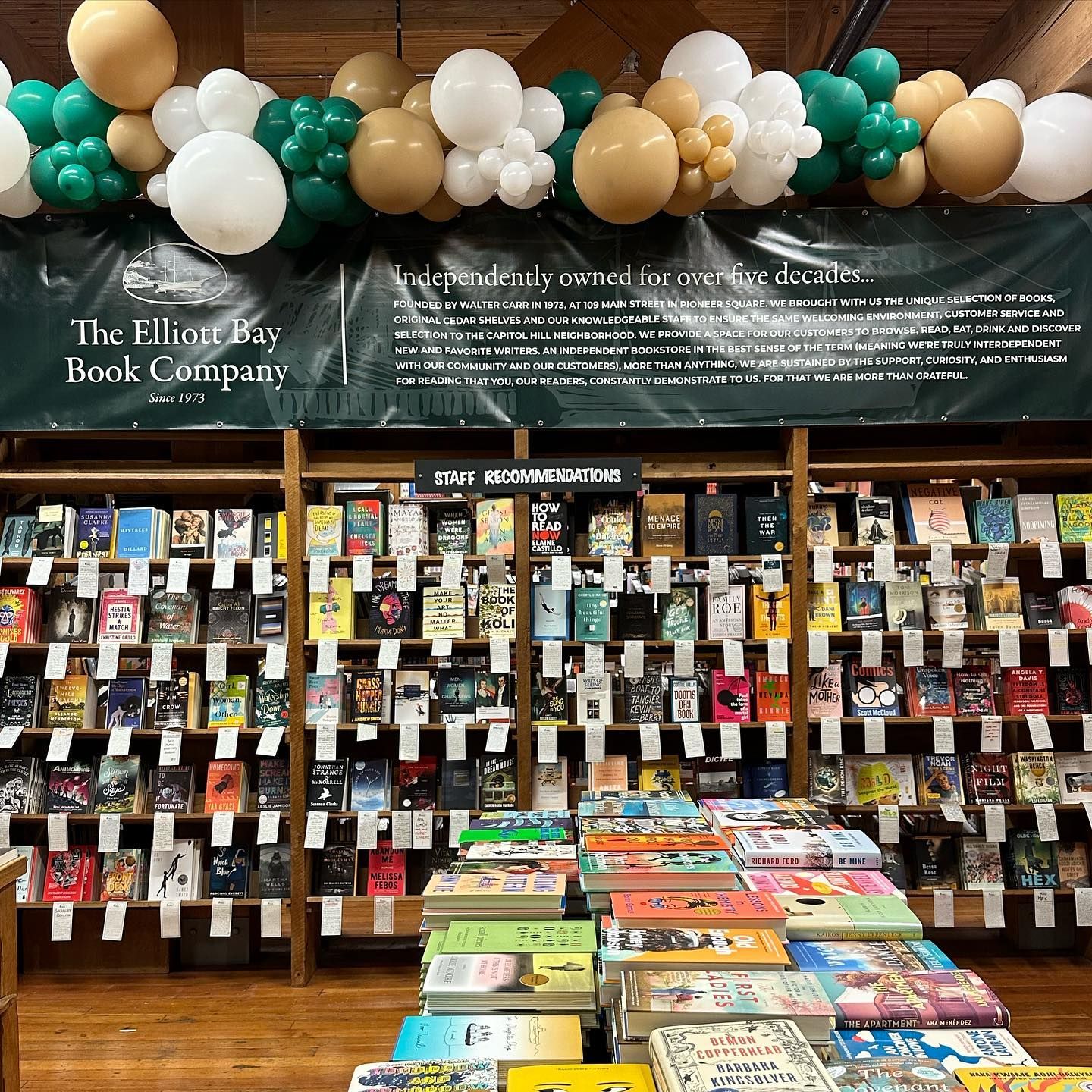 A book store filled with lots of books and balloons